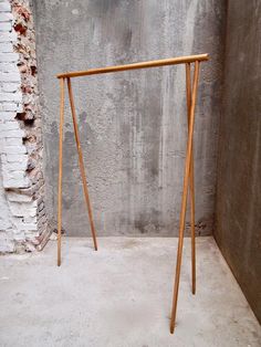 a wooden frame leaning against a wall