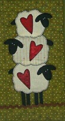 three sheep with hearts on their backs are standing in front of a polka dot wall hanging