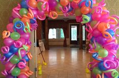 an entrance decorated with balloons and streamers