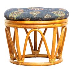 a wooden stool with a cushion on it