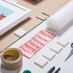 the supplies are laid out on the table to be used for making paper decorations and crafts