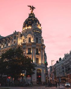 a tall building sitting on the side of a street