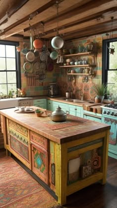 a kitchen with an island in the middle and lots of pots on the wall above it