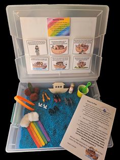 an open plastic box filled with toys and papers