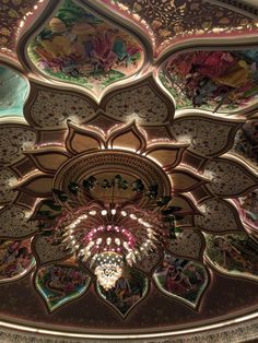 an ornate ceiling with many colorful designs on it