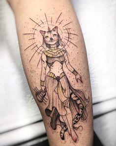 an egyptian cat tattoo on the right thigh and upper leg, it is black and white