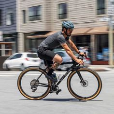 a man is riding his bike down the street