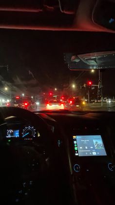 the dashboard of a car at night time