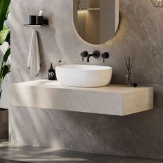 a bathroom with a sink, mirror and plants on the counter top in front of it