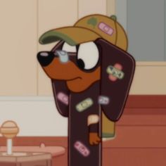 a cartoon dog wearing a hat and carrying a skateboard in his arms, standing next to a coffee table