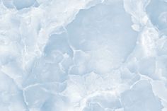 an abstract blue and white background with some ice flakes on the bottom right corner