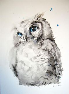 an owl with blue eyes sitting on top of a white wall