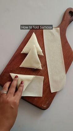 someone is making homemade ravioli on a cutting board