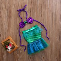 This little mermaid baby costume is the perfect outfit for your little mermaid. The set includes a stretchy tube top with faux pearls detailing. Matching elastic waistband bottoms, open mermaid skirt with ruffled hem. Great for photo props, birthday parties or any special events. Material: Polyester, Cotton Baby Mermaid Costumes, Mermaid Swimwear, Mermaid Top, Mermaid Swimsuit, Baby Boy Tops, Girl Sleeves, Newborn Boy Clothes