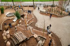 an aerial view of a children's play area in a park with lots of trees