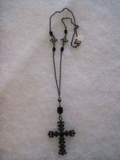 28" gunmetal goth cross with Jet bead and pewter/crystal accents. Cross measures 3"L x 2"W. Gothic Beaded Cross Jewelry, Adjustable Gothic Gunmetal Jewelry, Black Metal Crucifix Necklace, Black Metal Crucifix Cross Necklace, Black Metal Jewelry With Antique Finish, Gunmetal Cross Metal Jewelry, Black Metal Necklace With Antique Finish, Black Metal Crucifix Jewelry, Adjustable Metal Cross Necklace