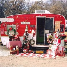 a red and white trailer with christmas decorations