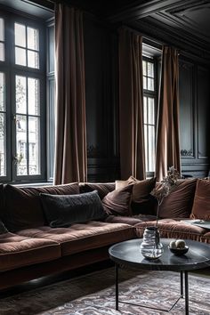 a living room filled with lots of brown furniture