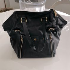 Authentic Ysl Downtown Bag Black Pebbled Leather With Metallic Sheen Gold Tone Brass Hardware Outside Pocket With Snap Closure Inside Zip Pocket Measures Approximately 8"L 15"W X 12”H Style No. 202649 Dgaog Made In Italy This Bag Has No Signs Of Wear And Is In Unused Like New Condition! Comes Withh Dust Bag And Ysl Authenticity Vintage Ysl Purse, All Black Ysl Bag, Ysl Black On Black Bag, Ysl All Black Bag, Ysl Tote Bag, Ysl Black Envelope Bag, Ysl Tote, Saint Laurent Black Tote Bag, Vintage Ysl