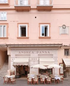 an outdoor cafe with tables and chairs outside