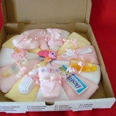 an open box with baby items in it