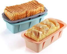 two plastic containers with bread in them on a white surface, one has a loaf of bread and the other is an orange container