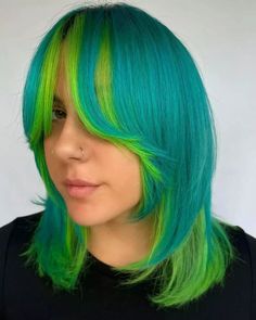 Dive into a world of color with a shoulder-brushing cut that merges the thrill of neon blue and green, complemented by soft, sweeping curtain bangs. It's playful, frames your face perfectly, and is a guaranteed head-turner. Click for more stunning ideas and follow us on Pinterest! ** Photo Credit: Instagram @maryh.ott Haircuts For Summer, Low Taper Fade, Low Taper