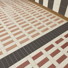 the floor is made up of different colored tiles