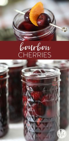 jars filled with cherries sitting on top of a table