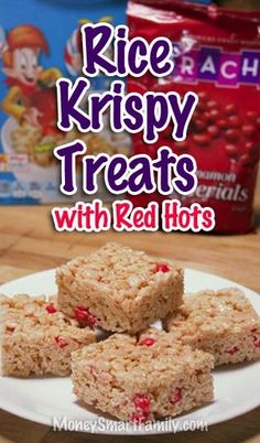 rice krispy treats with red hots on a white plate next to cereal boxes