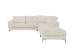 a white couch and ottoman sitting next to each other