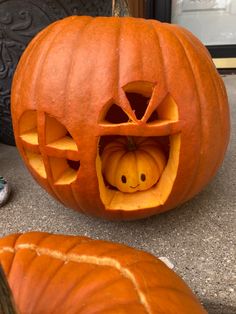 two pumpkins with faces carved into them