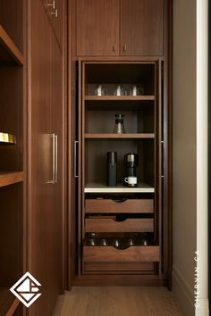 A concealed coffee bar with pocket doors. Pantry Pocket Door, Concealed Pantry, Coffee Pantry, Walnut Kitchen, Hidden In Plain Sight, Espresso Bar, Pocket Door, Pull Out Drawers