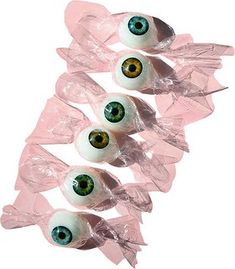 four plastic eyes are in the shape of candy