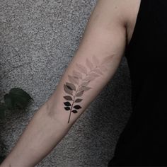 a person with a tattoo on their arm