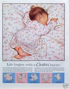 a baby laying in bed with the words life begins with a carezza layette