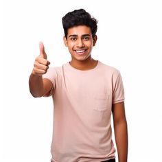 a young man giving the thumbs up sign