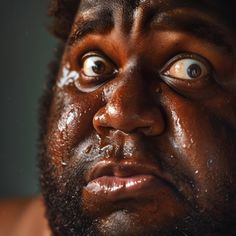 a close up of a man's face with mud all over his face and eyes