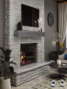 a living room with a fire place in the center and a clock on the wall