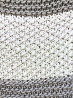 an image of some knitted material that is white and grey