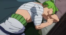 an anime character with green hair leaning against a wall and holding his hand to his face