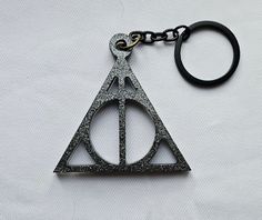 a harry potter keychain on a white background