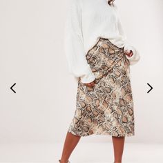 Petite Snake Print Midi Skirt White Winter Skirt For Day Out, Fall Cream Mini Skirt, Cream Lined Skirt For Fall, Casual Cream Pencil Skirt, White Midi Skirt For Fall, Chic Cream Fall Skirt, Winter Cream Lined Skirt, Cream Flowy Skirt For Fall, Cream Relaxed Fit Skirt For Fall