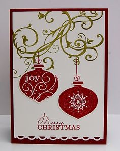 a christmas card with two ornaments hanging from it's sides and the words joy on top