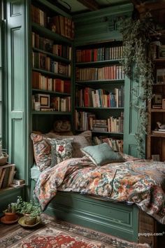 a bedroom with green bookshelves filled with lots of books and pillows on the bed