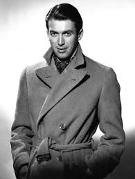 black and white photograph of man in trench coat