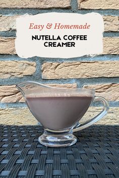 a glass cup filled with nutella coffee creamer