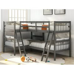 bunk beds with ladders are in the corner of a room that has white walls and wooden floors