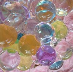 many different colored bubbles in a glass bowl