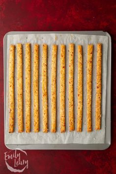 crackers lined up on a baking sheet ready to go into the oven for dipping